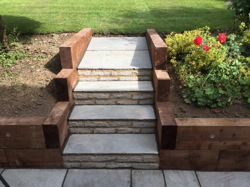 Patio with Sleeper Edging & Steps Leading to Garden - Allison Paving